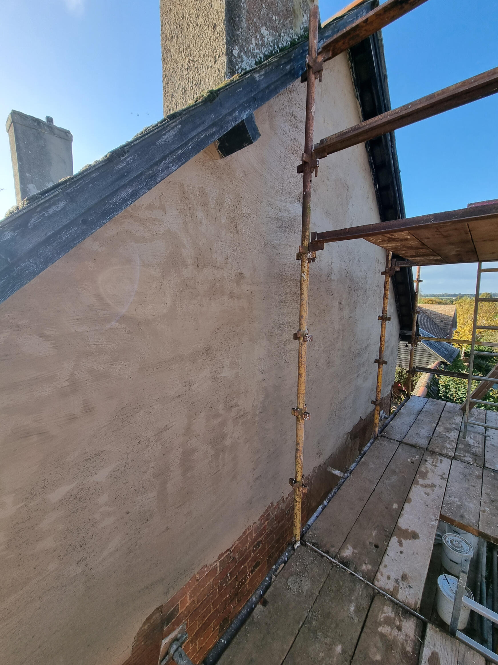 Lime mortar, brushed - intermediate coat.